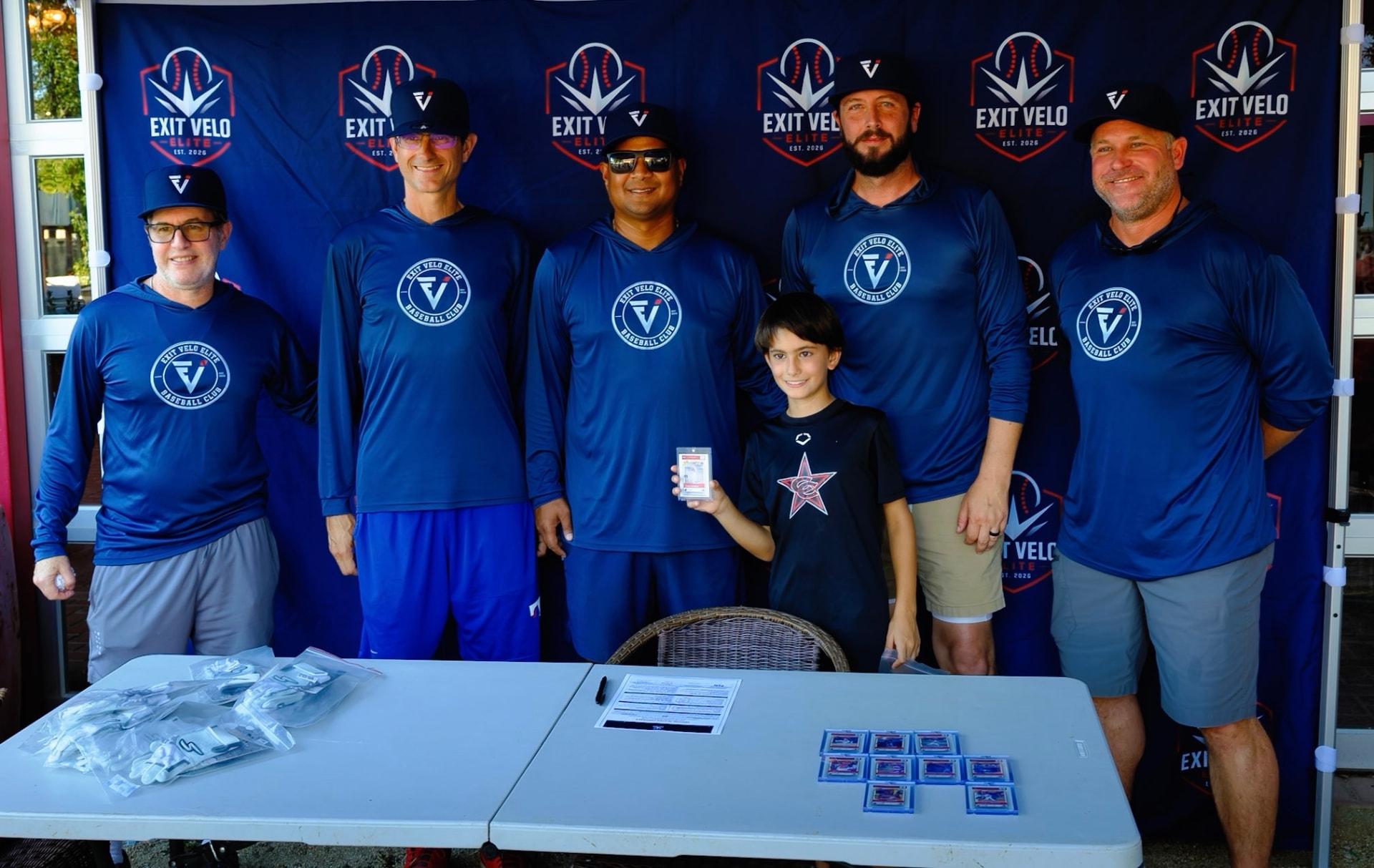 Coaches with a player and a full row of graded ZDecks cards